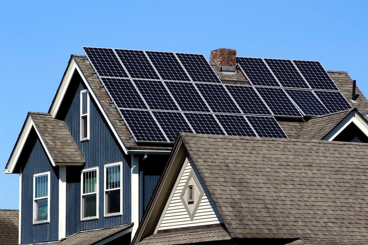 Rooftop 400w solar panel in a clear blue sky