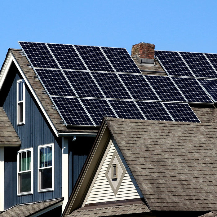 Rooftop 400w solar panel in a clear blue sky